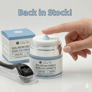 May include: A skincare product with the text "Back in Stock!" is displayed. The image shows a jar of "DUAL PEPTIDE FORMULA GHK-CU+SNAP-8" face cream, a box of the same product, and a black derma roller. The cream jar has a white lid and a light blue cream.