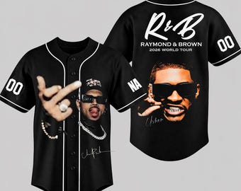May include: A black baseball jersey featuring white piping, button-down front, and short sleeves with the number 00. The front displays a portrait of a person wearing sunglasses and a chain. The back features the text R&B RAYMOND & BROWN 2026 WORLD TOUR.