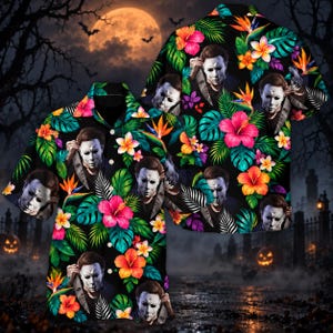 May include: A short-sleeve button-down shirt featuring a black background with a repeating pattern of Michael Myers character portraits, vibrant pink hibiscus flowers, orange bird of paradise flowers, and green tropical palm leaves.