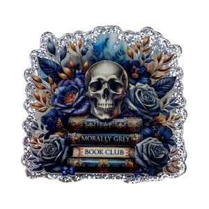 May include: A decorative image featuring a skull atop a stack of books, surrounded by blue roses and foliage. The books read "Morally Grey Book Club." The image has a glittery silver border and a dark, gothic aesthetic.