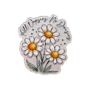 May include: A clear, glittery sticker featuring three white daisies with yellow centers and green leaves. The sticker has the text "All Dopsies. No Daisies" in a handwritten font.