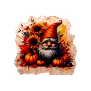 May include: A gnome with a long white beard and a tall red hat, surrounded by orange pumpkins, yellow sunflowers, and red autumn leaves. The illustration features a warm color palette with a textured, irregular border on a light background.
