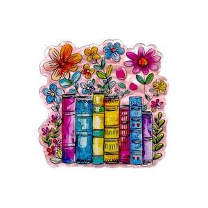 May include: A white ceramic mug with a black handle and the text "But First, Coffee" in a black, handwritten-style font. The mug is on a white surface.