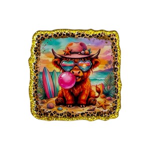 May include: A square-shaped image with a gold glitter and leopard print border. The image inside depicts a cartoon Highland cow on a beach, wearing heart-shaped sunglasses and a hat, blowing a bubble. Surfboards and seashells are also visible.
