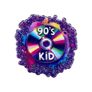 May include: A colorful enamel pin featuring a CD design with the text "90's KID". The pin has a vibrant rainbow CD design with a purple glitter border and paint splatter accents. A nostalgic accessory.
