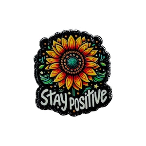 May include: A colorful sticker featuring a sunflower with yellow and red petals, a green center, and the words "Stay Positive" in white script. The sticker has a black scalloped border.