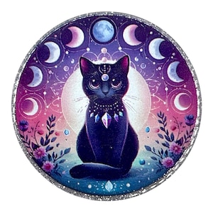 May include: A round, decorative image featuring a black cat with a jeweled collar, set against a backdrop of moon phases and a full moon. The design incorporates shades of purple, pink, and blue, with a silver glitter border.