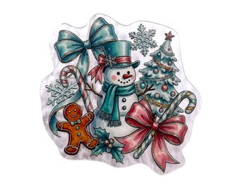 May include: A decorative sticker featuring a central snowman wearing a teal top hat and scarf, surrounded by a gingerbread man, a decorated Christmas tree, two candy canes with large teal and pink bows, and several white snowflakes.