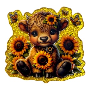 May include: A whimsical illustration of a Highland cow calf surrounded by sunflowers and butterflies. The calf has brown fur, a sunflower crown, and a sunflower necklace. The background is a glittery gold.