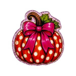 May include: A decorative pumpkin cutout featuring a vibrant orange surface with white polka dots, topped with a large, bright pink bow and a green leaf. The entire shape is outlined with a shimmering, light purple glitter border.