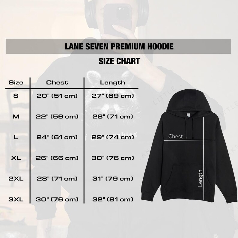 Puede incluir: Sudadera con capucha negra Lane Seven Premium con una tabla de tallas. La tabla muestra las medidas de pecho y largo en cm para las tallas S a 3XL. La sudadera tiene capucha y bolsillo delantero.