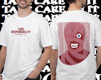May include: White t-shirts with a graphic design. The front of the shirt has the text "TAKE RESPONSIBILITY" in burgundy with Japanese text below. The back of the shirt features a mummy-like face with a single blue eye and a repeating text pattern.