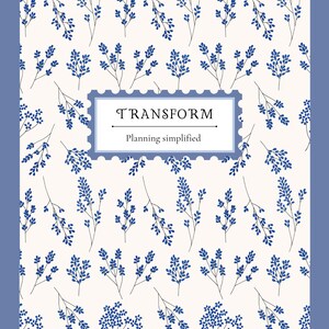 May include: A notebook with a blue floral pattern on a cream background. The cover features the word "TRANSFORM" in a rectangular frame, with "Planning simplified" below. The notebook has a blue border.