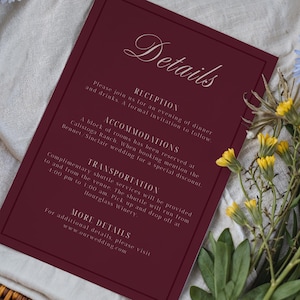 May include: A white ceramic mug with a black handle and the text "But First, Coffee" in a bold, black font. The mug is set against a blurred background, suggesting a cozy setting.