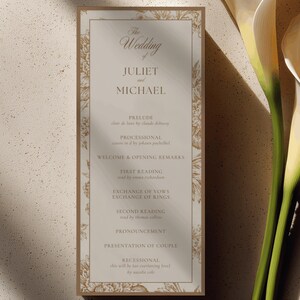 May include: A rectangular wedding program card with a beige background and a gold floral border. The text reads: The Wedding of JULIET and MICHAEL, followed by a list of ceremony events including Prelude, Processional, Welcome, Readings, Vows, and Recessional.