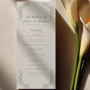Puede incluir: Un programa de ceremonia de boda rectangular impreso en papel blanco roto con texto gris oscuro e ilustraciones botánicas. El texto dice The Wedding Of Juliet & Michael, Saturday, August 8, 2026, seguido del orden de los eventos.