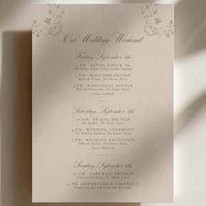 May include: A beige wedding weekend itinerary card with elegant script and floral accents. The schedule includes hotel check-in, welcome drinks, rehearsal dinner, bridal brunch, wedding ceremony, reception, farewell brunch, and departure details.