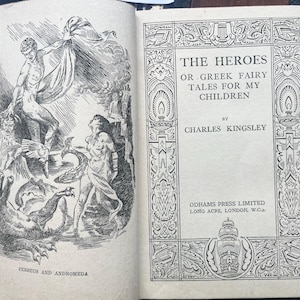 May include: Open book with illustrations and text. The left page features a detailed black and white illustration of Perseus and Andromeda. The right page displays the title "THE HEROES OR GREEK FAIRY TALES FOR MY CHILDREN" by Charles Kingsley.