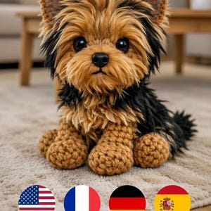 May include: A handmade crochet Yorkshire Terrier dog with brown, black, and tan yarn. The dog has large, dark eyes and a black nose. The dog is sitting on a beige rug. The dog's ears are brown and black.