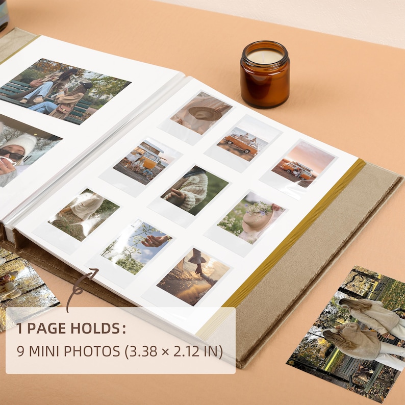 May include: Open photo album with nine mini photo slots, each holding photos. The album is open to a page with photos. The text on the image reads: 1 PAGE HOLDS: 9 MINI PHOTOS (3.38 x 2.12 IN). A small candle sits on the surface.