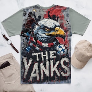Double-side All print shirt for World Cup support to Team USA. Pride of USA graphic featuring Eagle with USA flag scarf, in graffiti mural with elevated US player in stylized silhouette heading a ball.