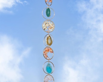 Crystal gemstone wall hanging suncatcher with natural stones and tree of life circles for boho home decor