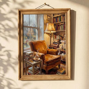 May include: A framed painting depicts a cozy reading nook. A brown leather armchair sits near a window, with a small table holding books and a cup of coffee. A floor lamp and a bookshelf filled with books complete the scene.