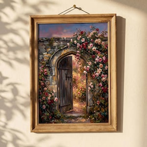 May include: A framed painting depicts an open wooden door in a stone archway, surrounded by climbing roses in shades of pink and red. The artwork has a warm, inviting feel, with a glimpse of a sunlit garden beyond the door.