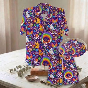 May include: A set of three ceramic mugs with a speckled, matte finish. The mugs are in shades of cream, light gray, and dark gray. Each mug has a simple, minimalist design and a rounded handle.