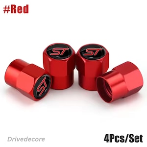 May include: Set of four red tire valve stem caps. Each cap has a black and silver ST logo. The caps are hexagonal in shape. The text "#Red" is in the upper left corner. The text "4Pcs/Set" is in the lower right corner.