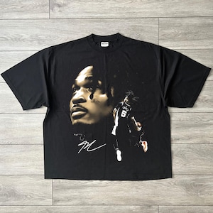 May include: A rustic wooden sign with the text "Welcome to our home" in white lettering. The sign features a distressed finish and a simple, inviting design, perfect for a front porch or entryway.