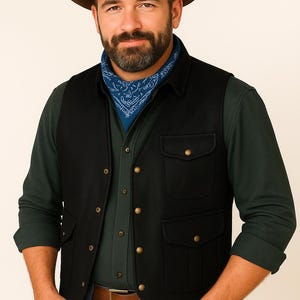 May include: A man wearing a brown fedora hat, a blue bandana, a black vest with four pockets, a green long-sleeve shirt, and a brown leather belt. The vest has gold-colored buttons.