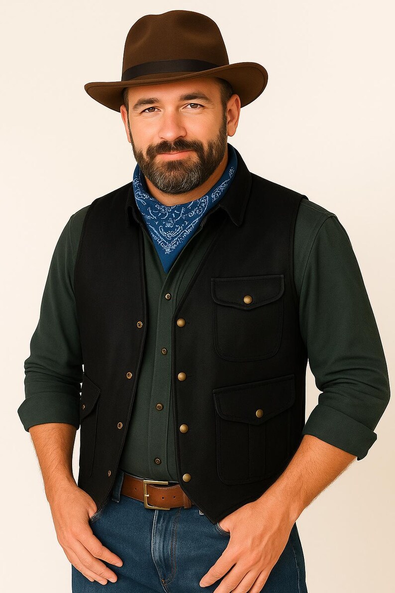 May include: A man wearing a brown fedora hat, a blue bandana, a black vest with four pockets, a green long-sleeve shirt, and a brown leather belt. The vest has gold-colored buttons.