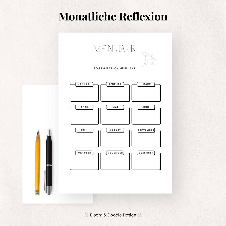 以下が含まれることがあります： 「Mein Jahr」と「Monatliche Reflexion」の黒い文字が入った白いプランナーページ。プランナーには、各月のボックスがあり、左側に黄色の鉛筆と黒いペンがあります。