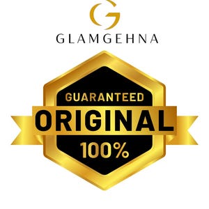 May include: A gold and black emblem with the text "GUARANTEED ORIGINAL 100%" on a black hexagon shape. The emblem is surrounded by a gold border and the brand name "GLAMGEHNA" is above the emblem.