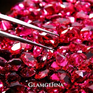 May include: A white ceramic mug with a black handle and the text "But first, coffee" in a black, handwritten-style font. The mug is on a white surface.