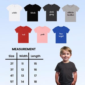 May include: A collection of seven short-sleeved t-shirts in white, black, dark gray, athletic heather, red, pink, and true royal. A measurement chart displays sizes 2T through 5T with corresponding widths and lengths in inches for each size.