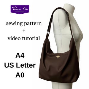 May include: A dark brown shoulder bag with a long strap is shown on a mannequin. The bag features a simple design with a small, round, gold-coloured emblem. Text on the image reads "sewing pattern + video tutorial" and "A4 US Letter A0". A logo for "Tatiana Kim" is visible.