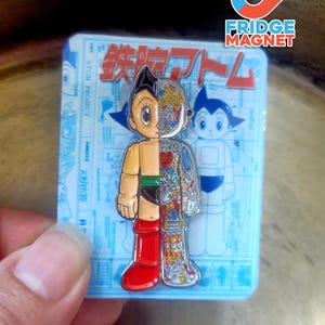 May include: A set of three ceramic mugs with a speckled, matte finish. The mugs are in cream, light grey, and dark grey. Each mug has a simple, minimalist design, ideal for coffee or tea.