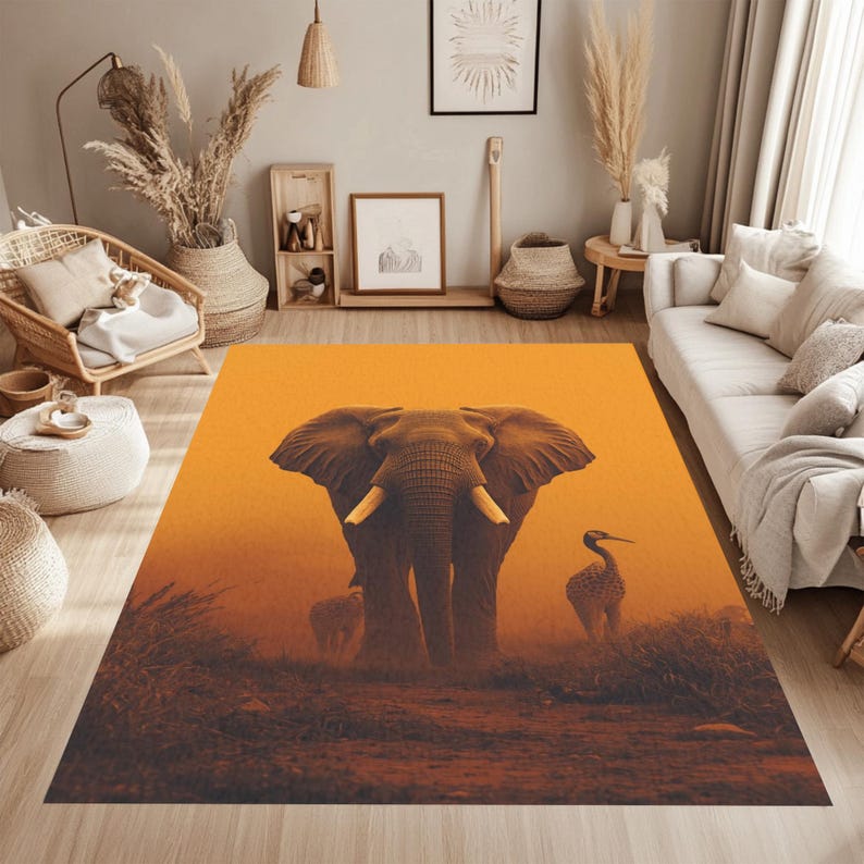 May include: A rectangular area rug featuring a majestic elephant with large tusks, set against a warm orange and brown background. The rug also depicts a bird and a baby elephant. The design evokes a safari theme.