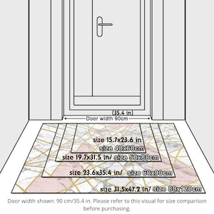 May include: Diagram showing door mats in various sizes, with measurements in inches and centimeters. The mats have a geometric design with gold lines on a white and pink background. The door width is 35.4 inches (90 cm).