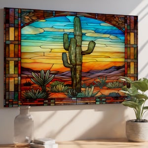 May include: A stained glass artwork depicting a desert scene with a large saguaro cactus as the focal point. The artwork features a vibrant color palette of blues, oranges, and greens, with a detailed desert landscape and a decorative border.