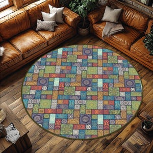 May include: A round area rug with a patchwork design. The rug features a variety of colors including blue, green, red, and orange. The design includes geometric shapes and floral patterns. The rug is placed on a wooden floor.