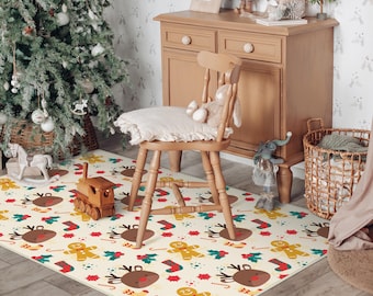 May include: A cream-coloured rectangular Christmas rug with a repeating pattern of reindeer, gingerbread men, holly, and candy canes in red, brown, green, and yellow. A wooden toy train is placed on the rug.