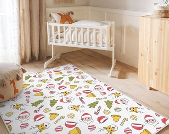 May include: A rectangular white Christmas-themed rug featuring a repeating pattern of Santa Claus, reindeer, Christmas trees, bells, and candy canes in red, green, and yellow. The rug is on a wooden floor in a room with a cot.