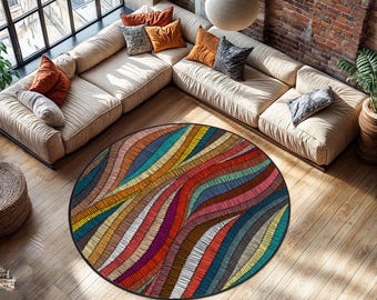 May include: A round area rug with a vibrant, abstract design. The rug features a black border and a pattern of colorful, wavy lines in shades of red, orange, yellow, green, blue, and purple. The rug is placed on a hardwood floor.