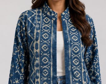 May include: A long-sleeved, open-front jacket in deep blue with a light beige block-print pattern. The garment features a mandarin collar, straight hem, and vertical panels of geometric and floral motifs running along the front placket.