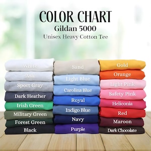 May include: Color chart for Gildan 5000 Unisex Heavy Cotton Tee. The chart displays a variety of colors, including white, ash, sport gray, dark heather, Irish green, military green, forest green, black, sand, light blue, Carolina blue, royal, indigo blue, navy, purple, gold, orange, light pink, safety pink, heliconia, red, maroon, and dark chocolate.