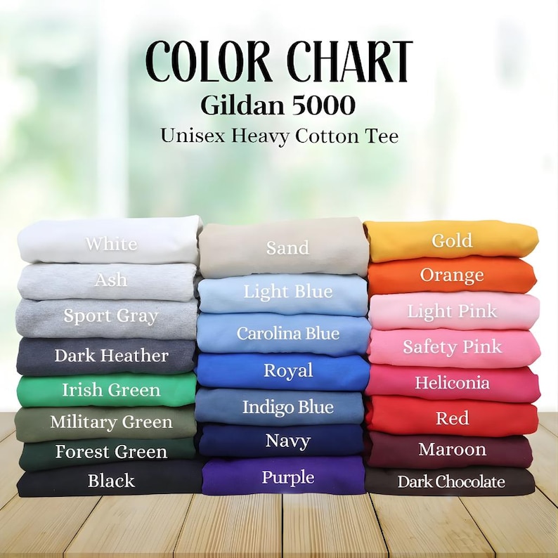 May include: Color chart for Gildan 5000 Unisex Heavy Cotton Tee. The chart displays a variety of colors, including white, ash, sport gray, dark heather, Irish green, military green, forest green, black, sand, light blue, Carolina blue, royal, indigo blue, navy, purple, gold, orange, light pink, safety pink, heliconia, red, maroon, and dark chocolate.