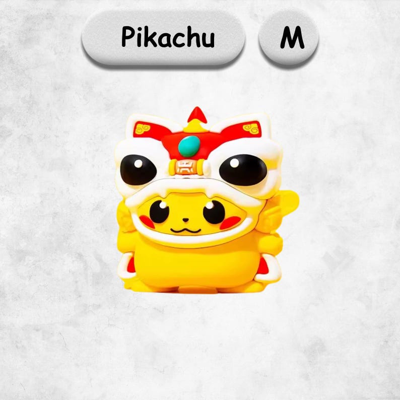 May include: A yellow Pikachu figure wearing a white, red, and gold lion dance costume with a teal accent. Above the figure, the text reads Pikachu and the letter M. The character has black eyes, red cheeks, and a small mouth on a yellow body.